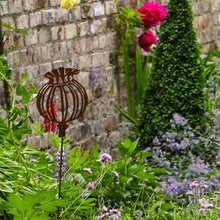 Load image into Gallery viewer, Rusty Poppy Seed Garden Sculpture
